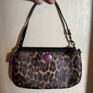 Coach hand purse. Cheetah with purple accents.